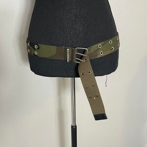 Green camo belt with silver hardware and grommets